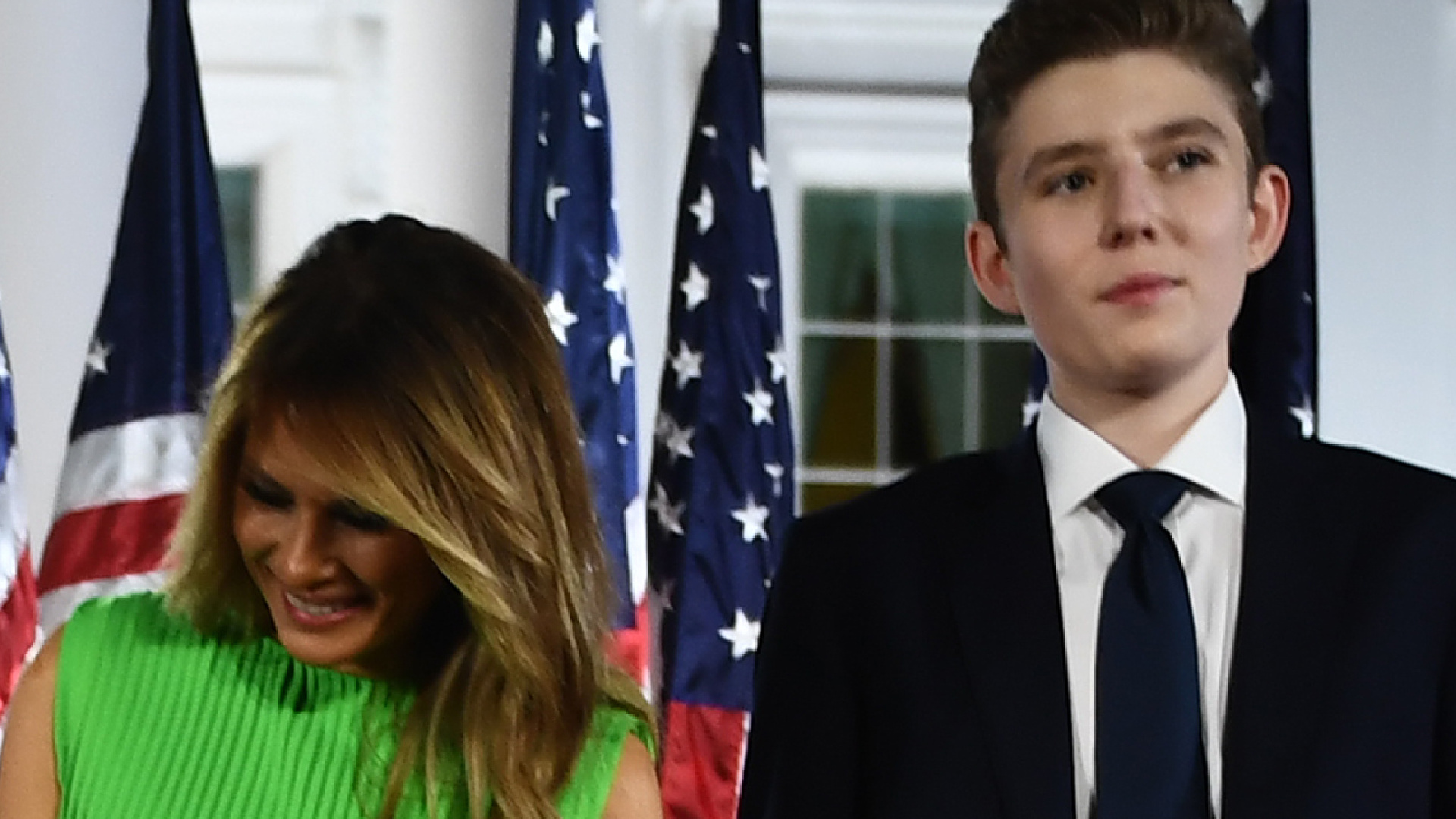 Melania Trump, closely attentive to her son Barron